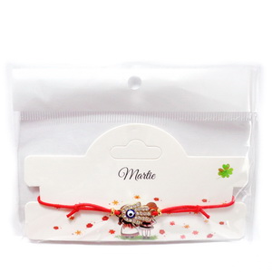 Bratara reglabila, ata rosie elastica, cu mana Hamsa aurie, ochi norocos si strasuri